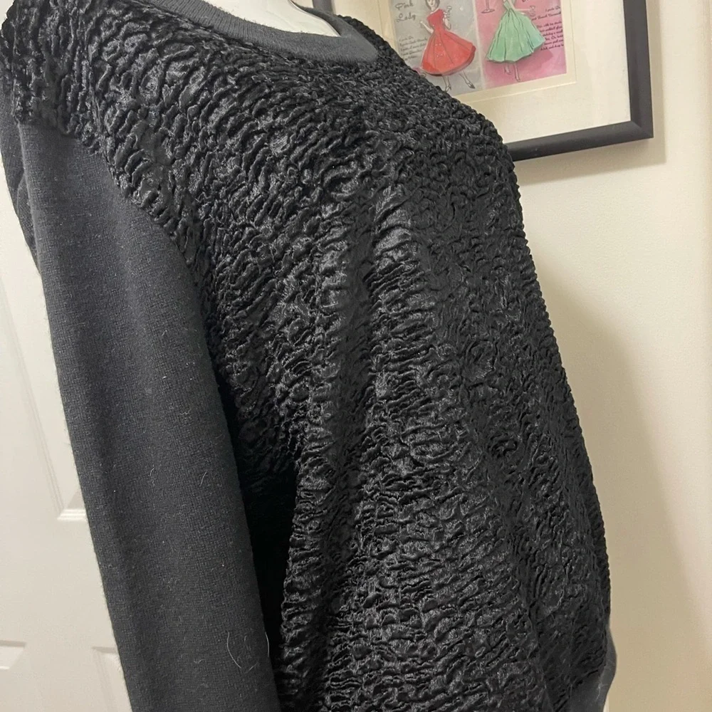 Kate spade black sweater. Looks like Front made with the unique sheep fur.